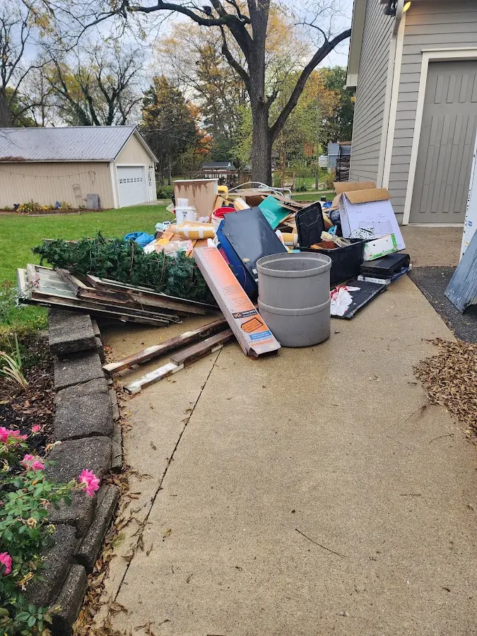 Dumpster being loaded with debris for 3 Yard Dumpster Rental in Blaine